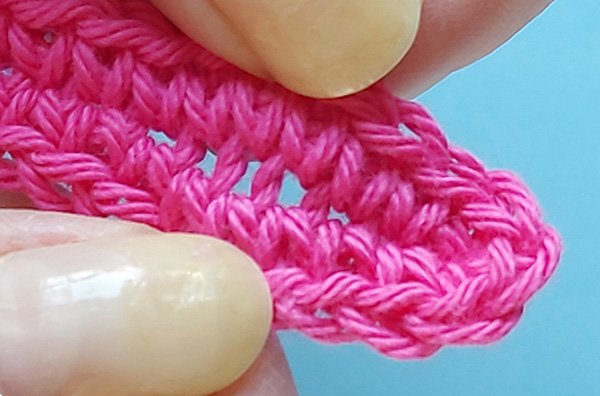 showing holes that come from crocheting around chain the wrong way